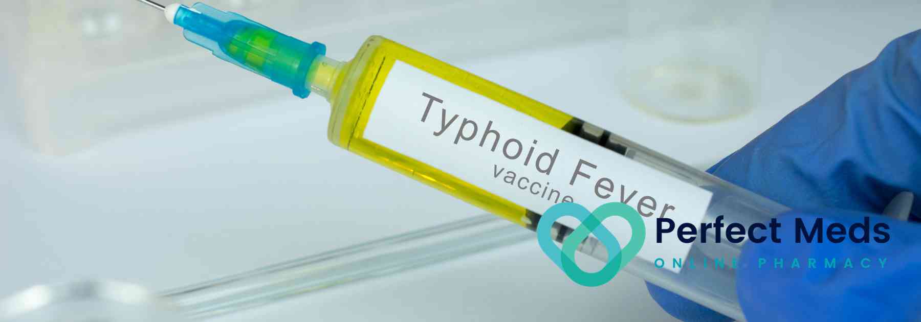 person wearing medical glove holding typhoid vaccine