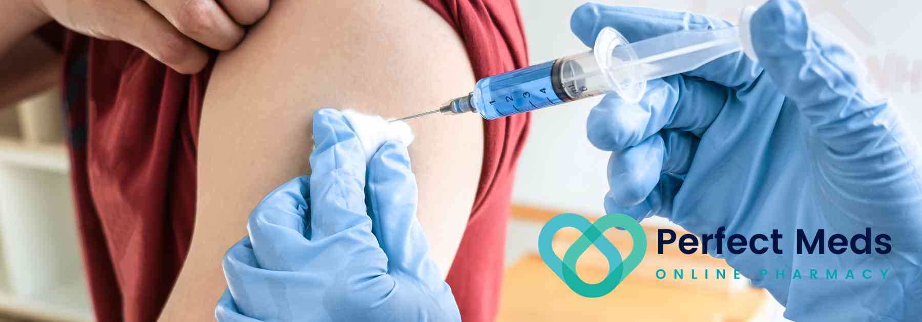 patient in red shirt receiving vaccine in arm