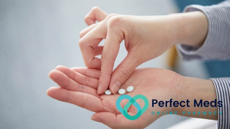 person holding white pills in their hand