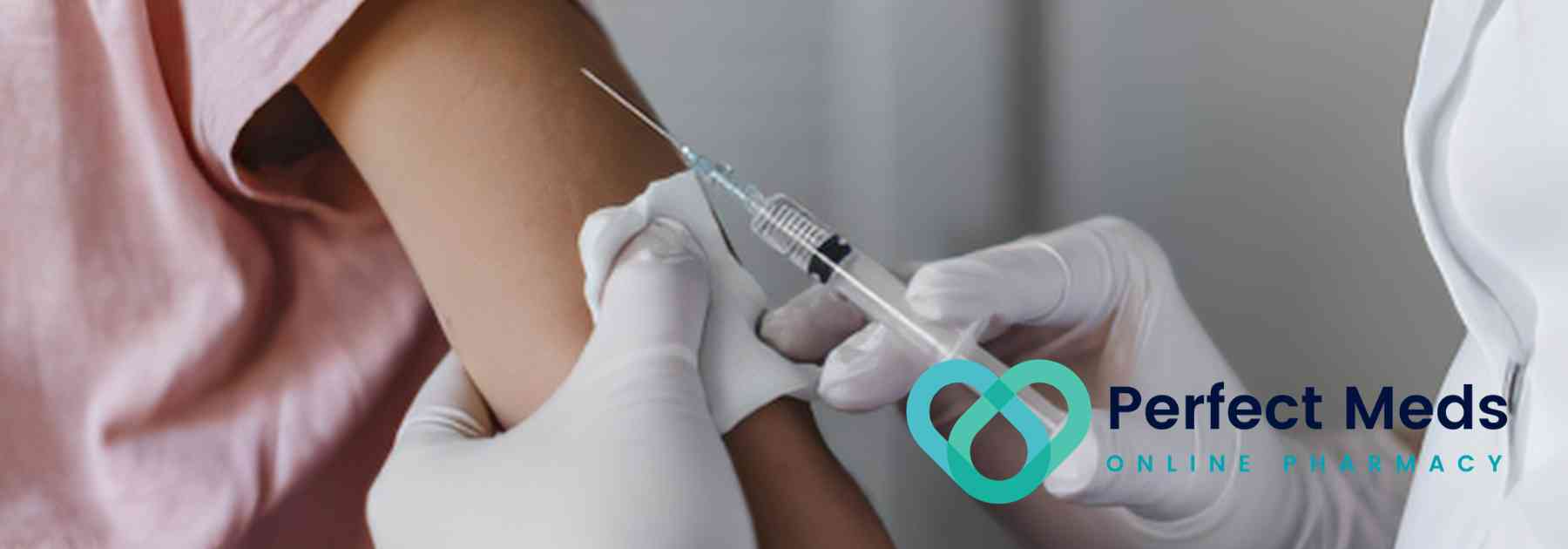 patient in pink shirt receiving vaccine
