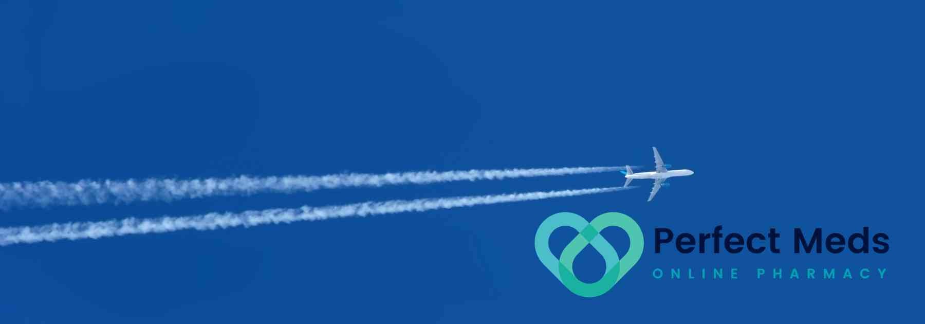 plane flying in dark blue sky