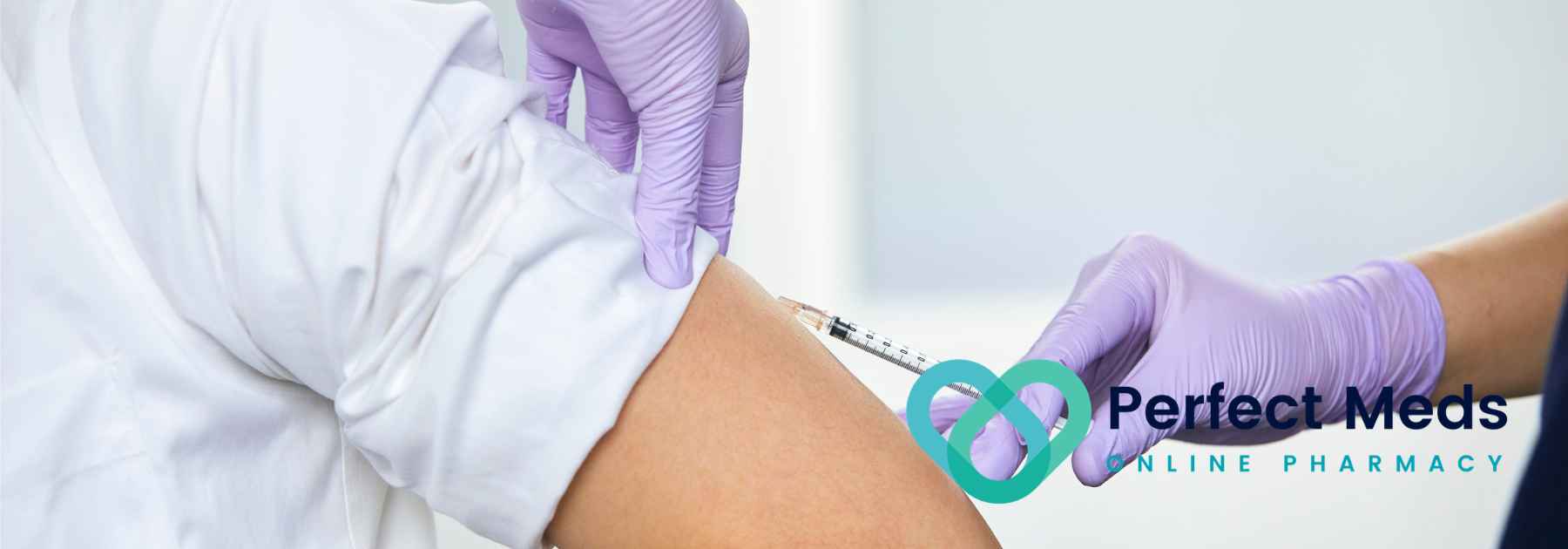 patient in white shirt receiving vaccine in arm