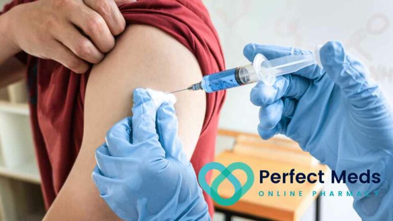 person in red shirt receiving vaccine