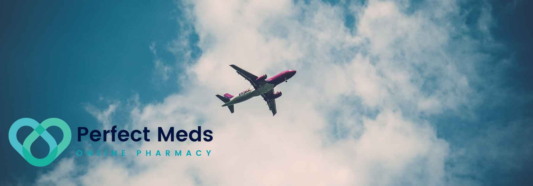 plane flying in blue cloudy sky