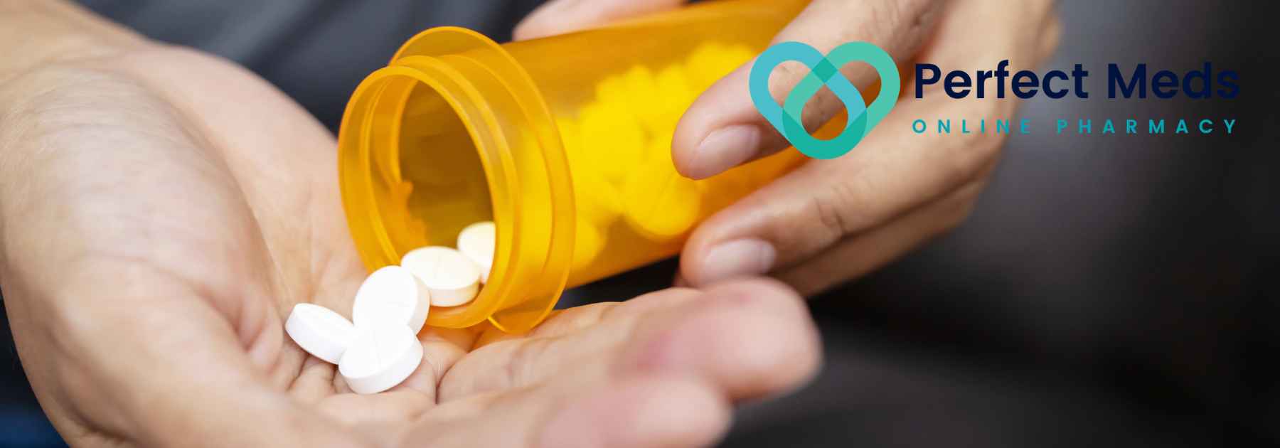 person emptying white pills from orange container