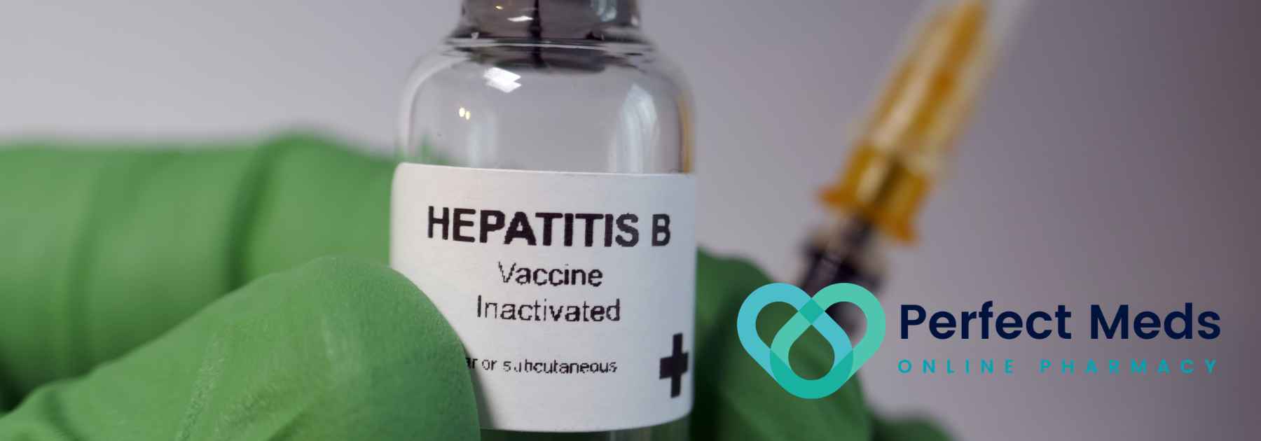 person wearing green medical glove holding hepatitis b vaccine