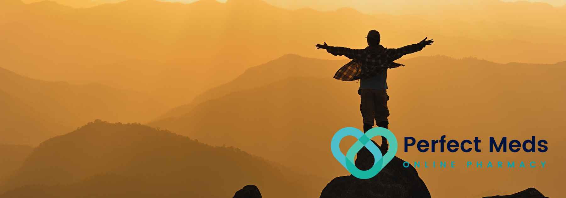 tourist looking at view of mountains at sunset with arms outstretched