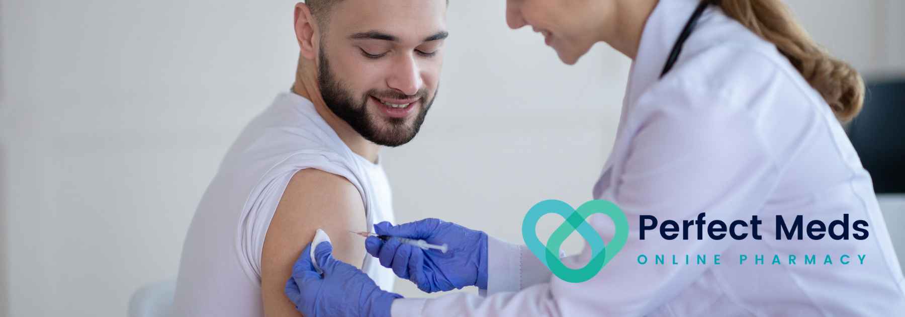 female medical professional administering vaccine to young male patient
