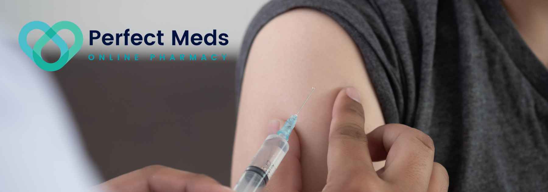 patient in grey shirt receiving vaccine