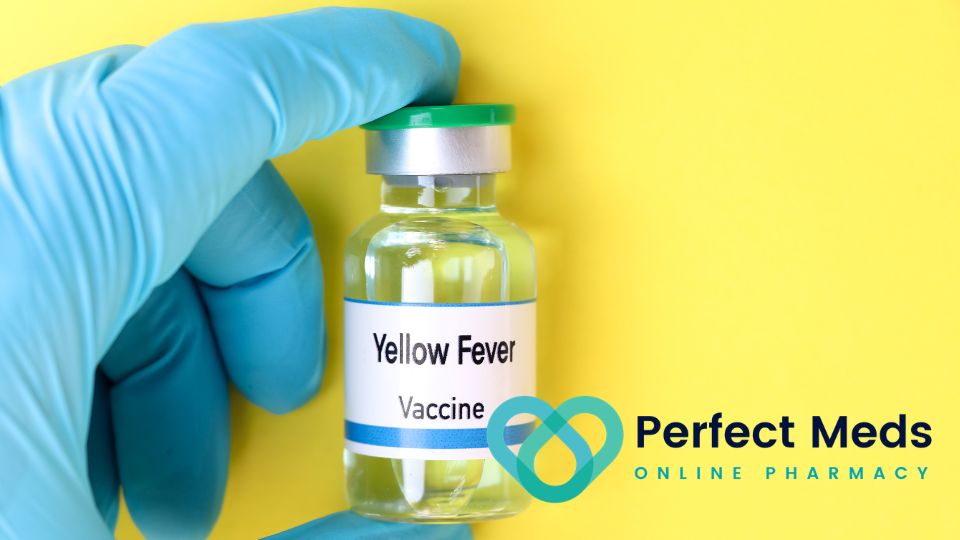 person wearing medical glove holding yellow fever vaccine on yellow background